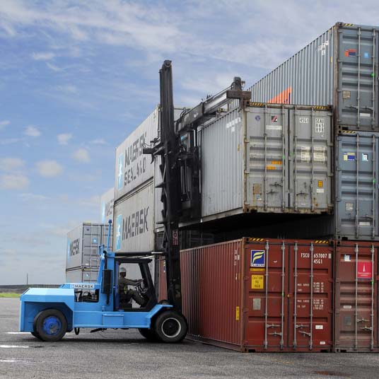 Large forklift lifting containers